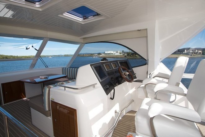 Dual seats, forward lounge area and helm set well aft to enable clear vision when backing down on a fighting bill. - Maritimo 500 Offshore Convertible © SW